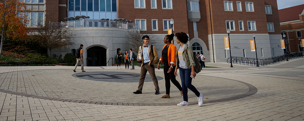 Students walking outside Haslam Business Building